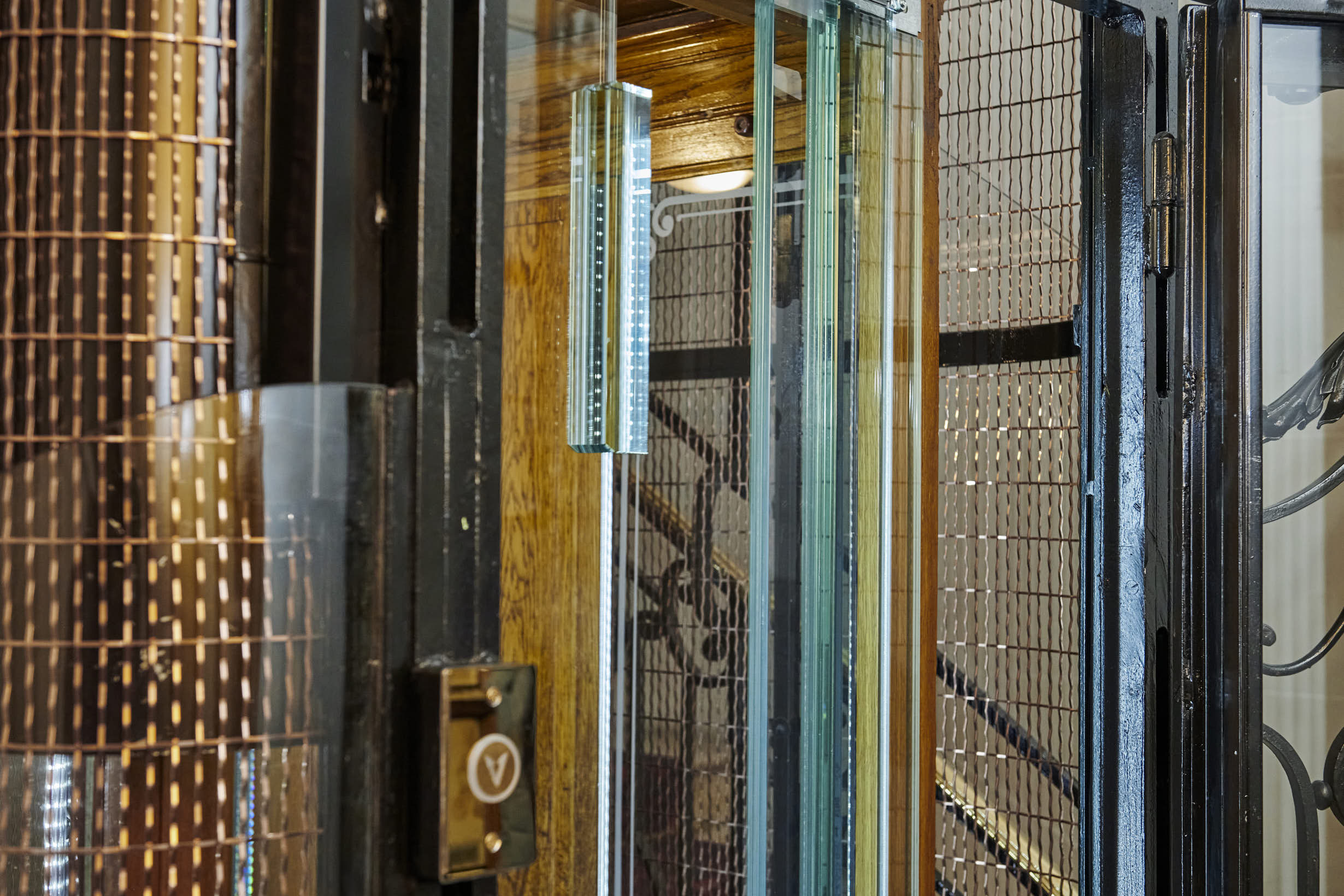 Detail of Absolute full glas panels and existing lift